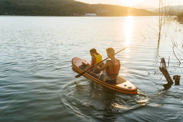 istock Summer Splash: Teenagers Enjoy Fun on a Paddleboard 2205263759