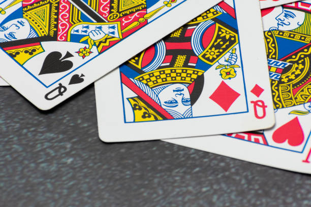 istock Scattered collection of playing cards, featuring various suits, numbers, and partial card faces. Chaotic arrangement creates a dynamic scene, symbolizing the unpredictability and thrill of card games 2205263914