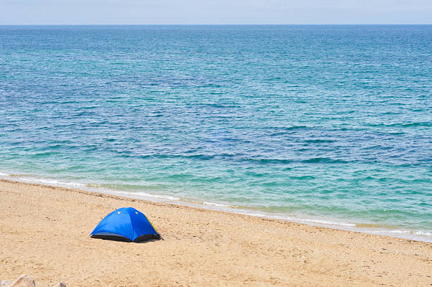 istock Blue Tent on a Sandy Beach by the Sea 2205264189