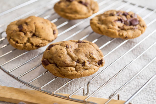 istock Homemade freshly baked chocolate chips cookies on oven rack 2205265532