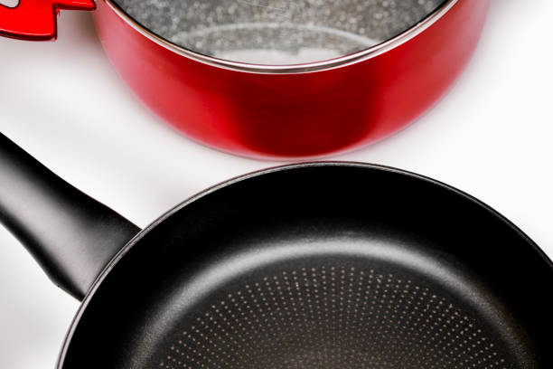 istock Non-Stick Frying Pan and Red Cooking Pot on White Background 2205266392
