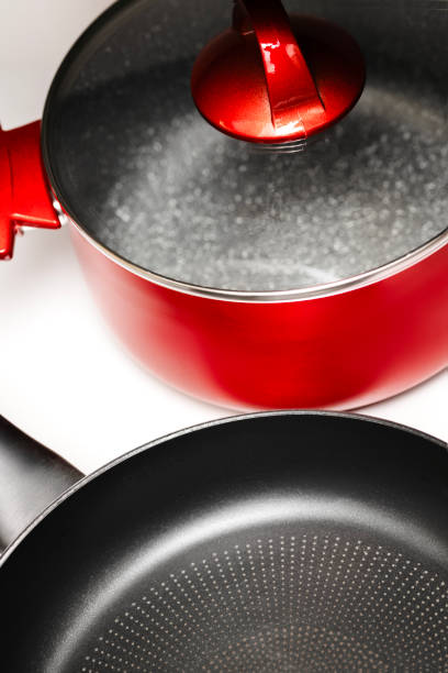 istock Non-Stick Frying Pan and Red Cooking Pot on White Background 2205266410