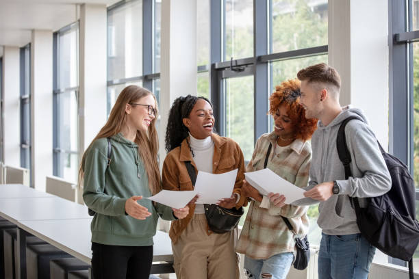 istock University students discussing exam results 2205269086