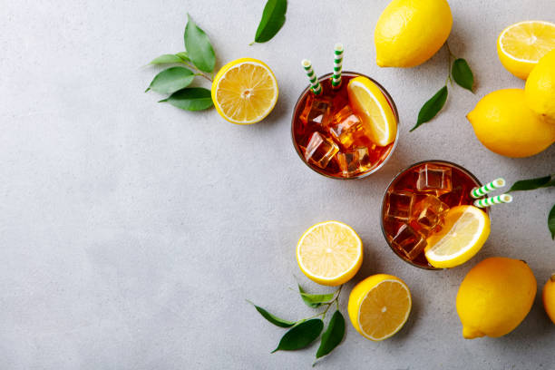 istock Fresh ice tea with fresh lemons. Grey background. Copy space. Top view. 2205270071