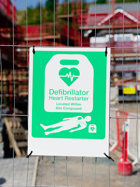 istock Defibrillator sign on fence at construction building site 2205272571