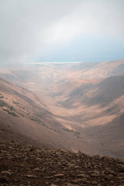 Arid mountains and mist above sea, Fuerteventura, Canary Islands