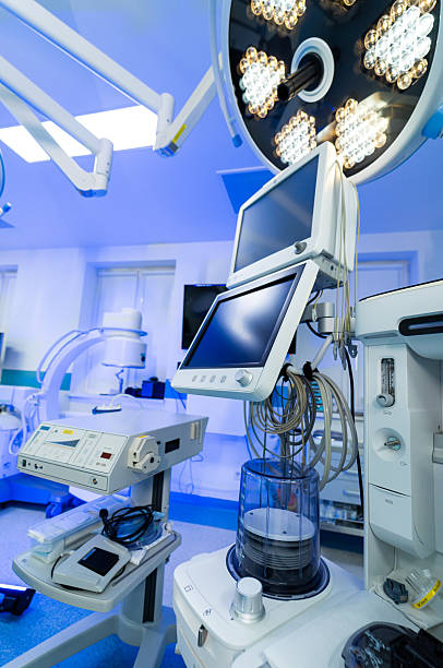 istock Modern neurosurgery tools. Advanced surgical instruments and monitors are prepared for a neurosurgery procedure in a sterile operating room. 2205276818