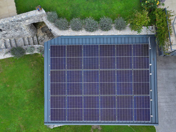 istock AERIAL TOP DOWN: Home carport equipped with modern rooftop solar energy system 2205282497
