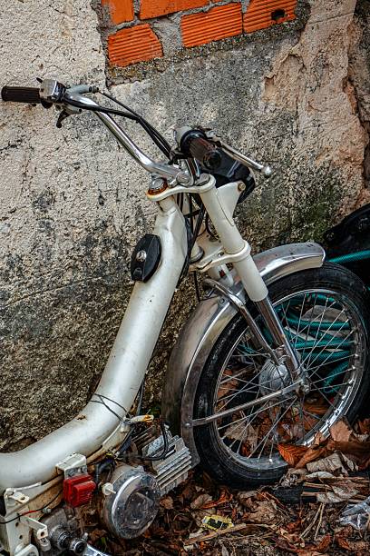istock Old white moped abandoned on the street 2205282597