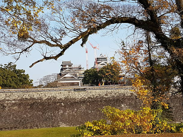 Daitenshu (right, main castle tower) and Shotenshu (center, small castle tower) with Uto Yagura (left) at Kumamoto Castle on Kyushu island. The castle has been constructed in the early 1600s. Kumamoto Castle suffered serious damage by earthquakes in April 2016. Reconstruction works are expected to continue until around 2042.