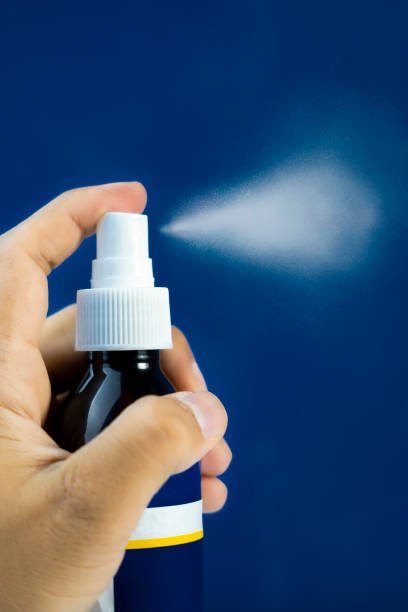 istock Hair Growth Spray Bottle Mockup with Water Mist Effect Isolated on Blue 2205286351