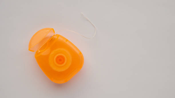 istock dental floss in case on white background 2205293055