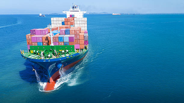 istock Aerial front view of cargo ship carrying container and running for export goods from cargo yard port to custom ocean concept technology transportation 2205294291