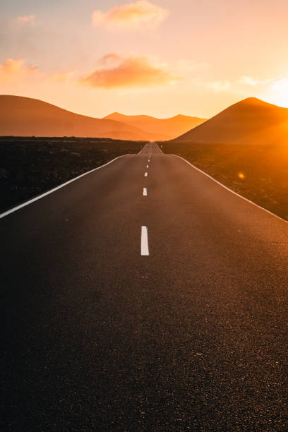 istock Close-up looking down road at sunrise 2205299166