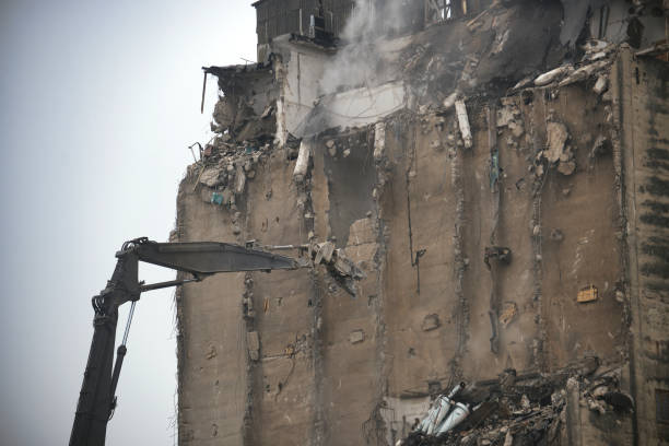 istock Demolition Process of an Industrial Building Using Excavator Equipment 2205301533