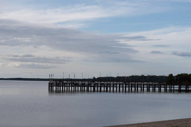 istock fishing pier with background picturesque sky and vast river confluence 2205304238