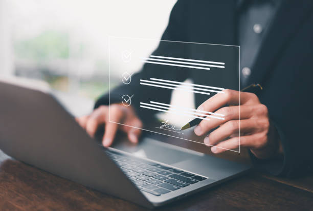 istock document on digital document on page Electronic signature concept Writing business agreement Digital document management Paperless office 2205305568