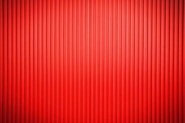 Texture of a red corrugated sheet metal facade