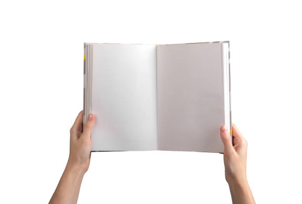 istock A person holding an open, blank book or notebook, showcasing clean, white pages for writing, reading 2205305819