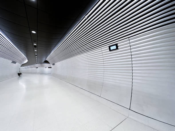 A passageway linking platforms at Tottenham Court Road station on London's newest undergound line, the Elizabeth Line, which partially opened in May 2022 after being delayed for some years.