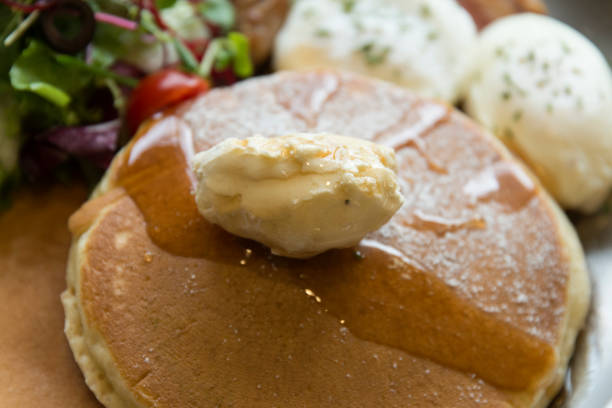 istock pancake, sausage, bacon and salad on the dish 2205311253