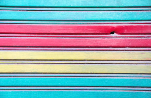 istock Colorful paint texture of shutter door wall with seamless patterns abstract red yellow blue rusty background 2205312298
