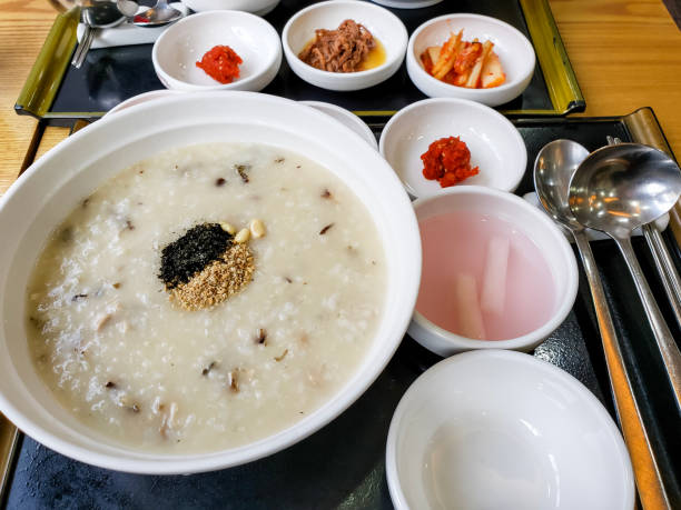 istock Freshly prepared Korean Rice Porridge (Congee) breakfast, with many side dishes. 2205313110
