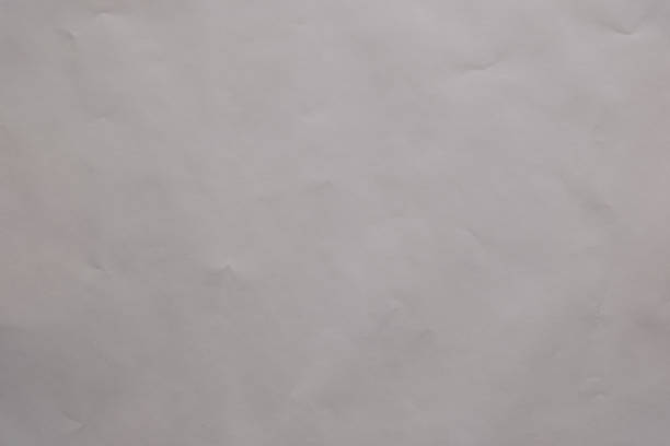 istock Texture and Abstract Background: The subtle play of light and shadow on a crumpled off white sheet creates an abstract canvas 2205313543