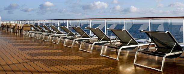 istock Deck chairs on a cruise ship with ocean view. 2205315227