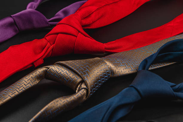 Various ties in different colors are neatly arranged, ideal for gifting on fathers day or a birthday. The vibrant colors create a festive atmosphere for celebrating fathers