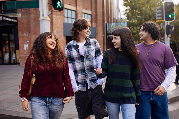 istock Teenagers walking on a street 2205322045