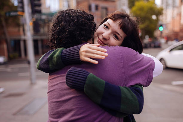 istock Young couple hugging on a street 2205322281
