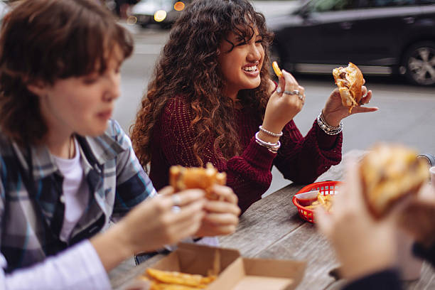 Teenagers eating fast food