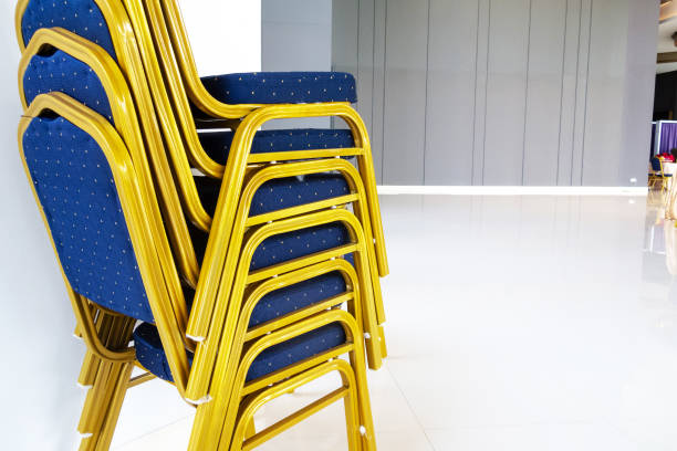 istock Colorful Stacked Chairs in Modern Indoor Space with Bright Floor 2205326080
