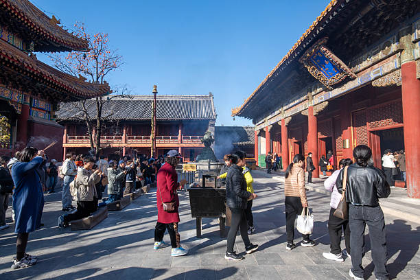 Beijing, China- 5 Nov 2024: Visitors are praying at The Yonghe Temple, also known as the Yonghe Lamasery in Beijing