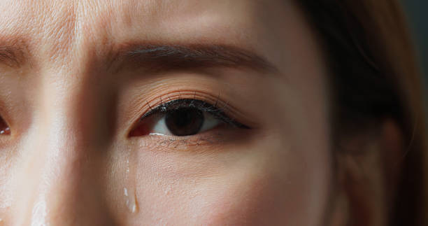 istock tears rolling down woman eye 2205336481