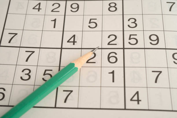 istock Sudoku puzzle, game to play for keep you brain younger for developing Alzheimer disease in senior patient. 2205338401