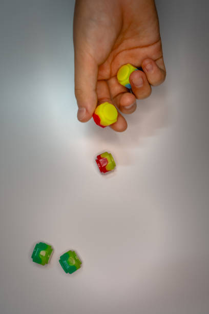 Korean traditional game kit Gonggi. Colourful plastic stones on the hand.
