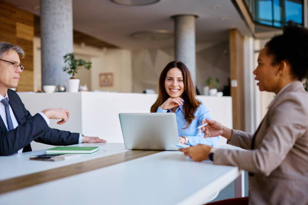 istock Businesspeople having a meeting in a modern office 2205341916