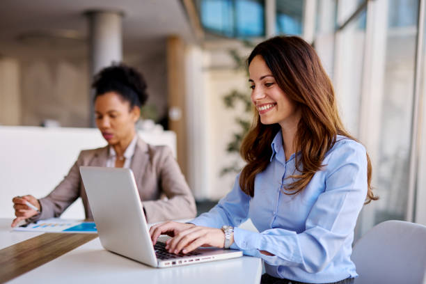 istock Businesswomen working with laptop and documents in the office 2205341921