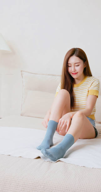 istock asian young woman wear socks 2205342184