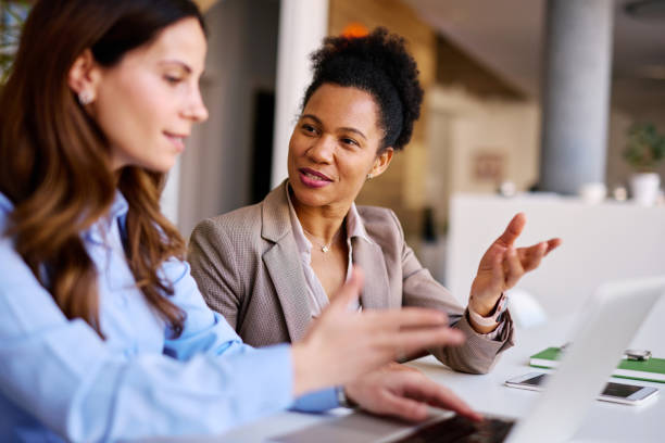 istock Businesswomen discussing working using laptop in the office 2205342197