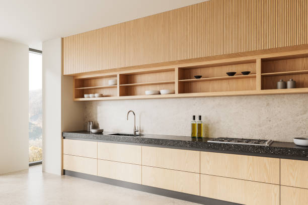 istock Modern minimalist kitchen interior with wooden cabinets and neutral tones. 3D Rendering 2205342429