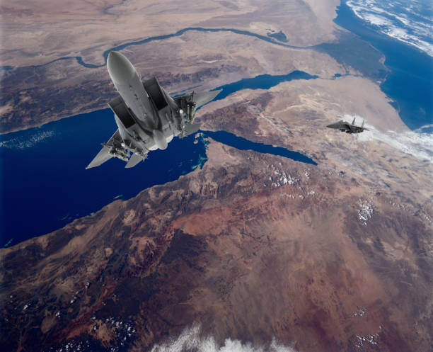 istock Air Force Fighter Jets flying over clouds. High Above The Clouds. 2205345360