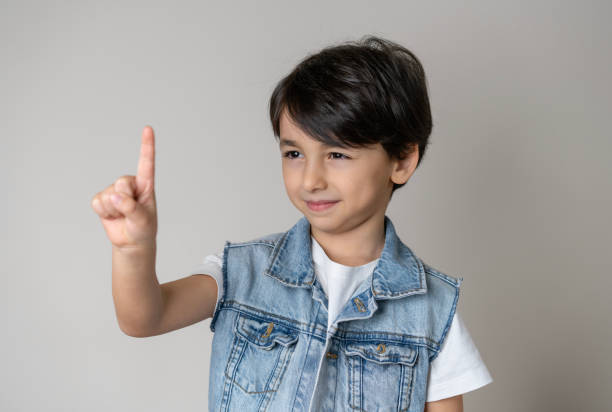 Child's hand showing four fingers isolated on white background. hands show four counts