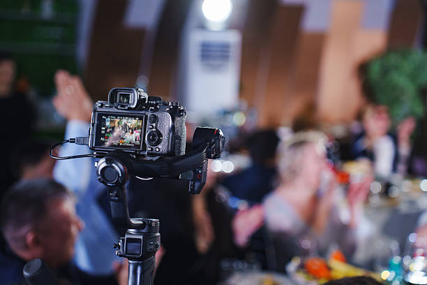 Camera captures lively celebration at a festive gathering in a banquet hall