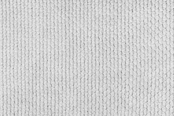 istock Texture of velour jacquard white fabric close up, macro. Cloth structure, textile background 2205348459