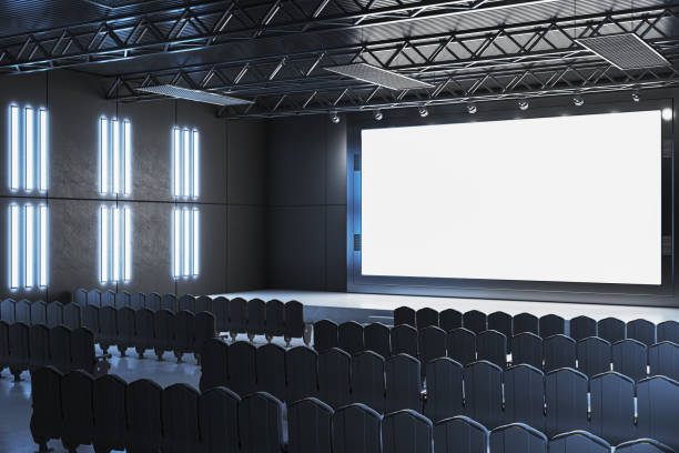 istock Modern cinema interior with large blank screen and empty black chairs. 3D Rendering 2205348766