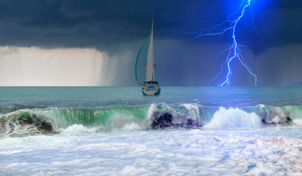 istock Sailing yacht in a stormy weather with thunder and lightning 2205349027