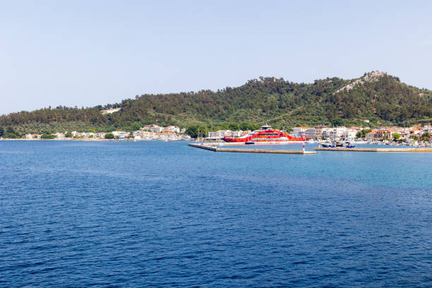 Limenas, Thassos, Greece -June 12, 2024: Port view with ferry boat and harbor